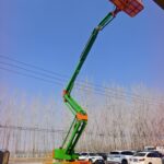 Articulated Boom Lift Diesel articulated boom lift with the jib raised on an outdoor site