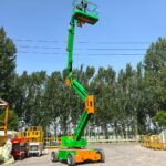 Articulated Boom Lift Articulated boom lift reaching over an obstacle