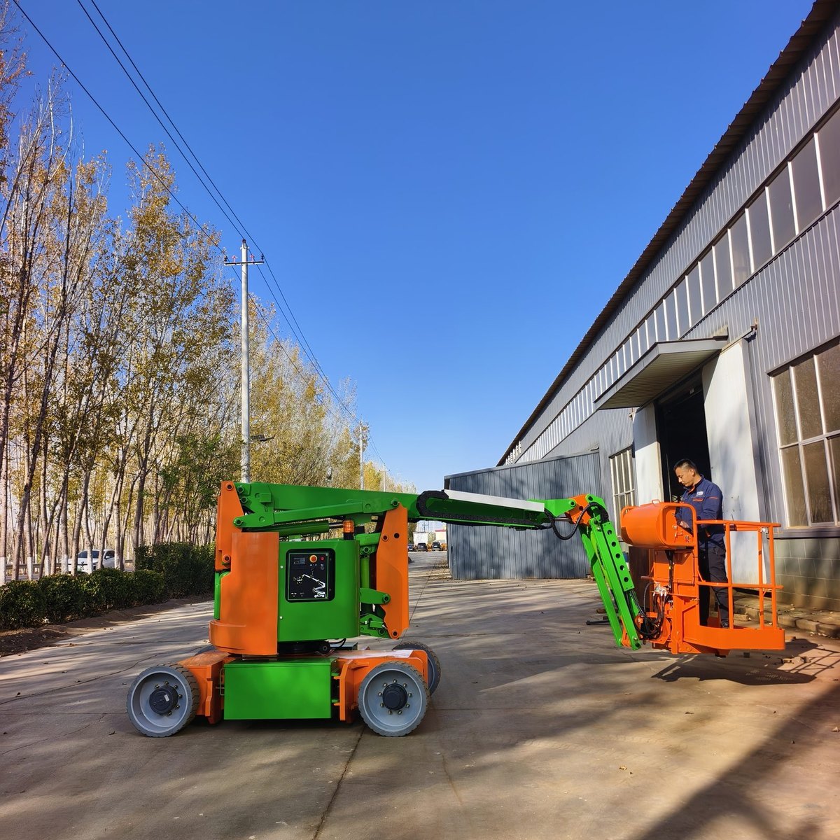 Articulated boom lift platform and control console