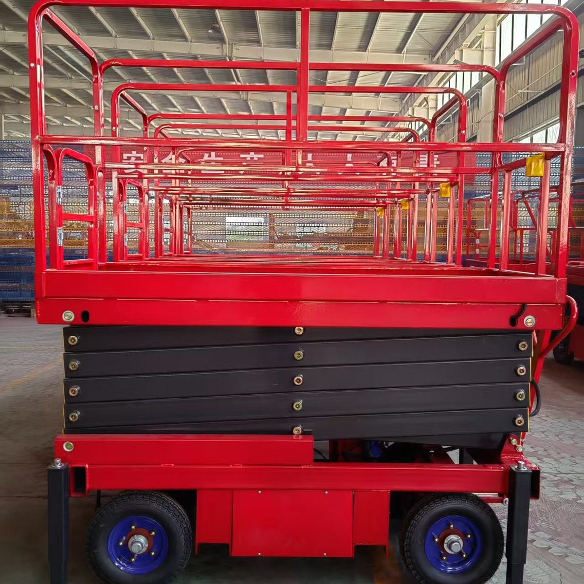 Home Hand-push scissor lift with the outriggers extended